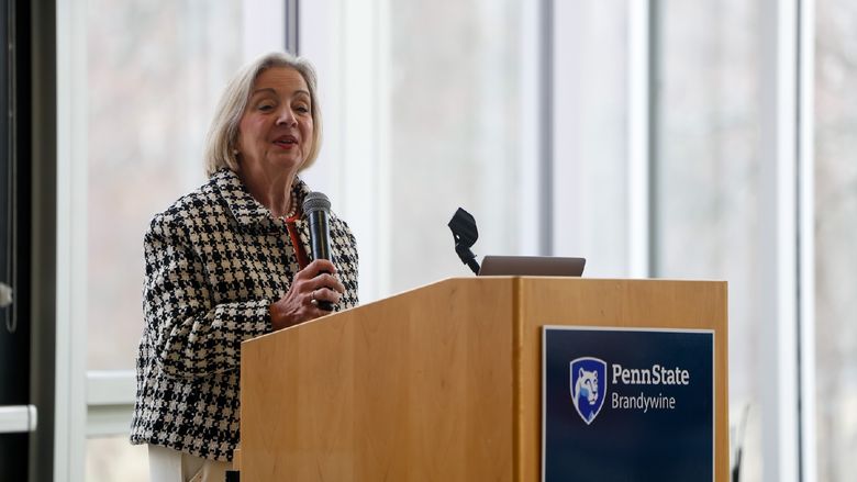woman speaking at podium