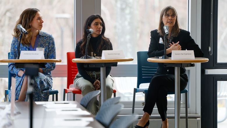 women speaking on a panel
