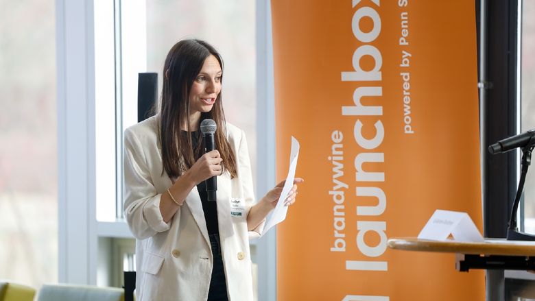 woman speaking into microphone