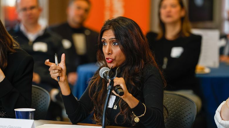woman speaking into microphone