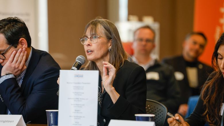 woman speaking into microphone