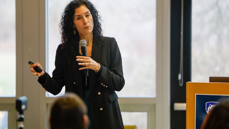 woman speaking into microphone