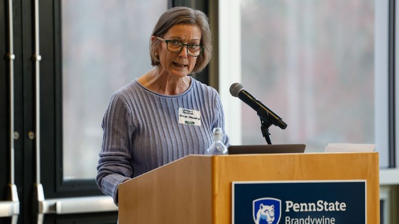 woman speaking at podium