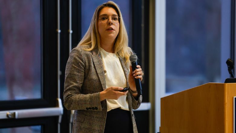 woman speaking into microphone