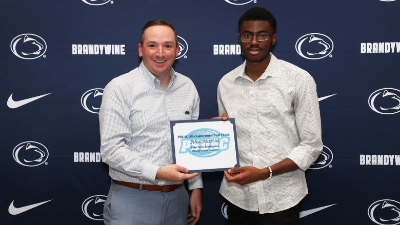 two men holding a certificate
