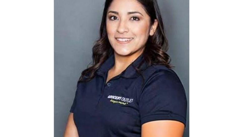 Amanda Paez wearing polo that says Grocery Outlet Bargain Market in top right corner