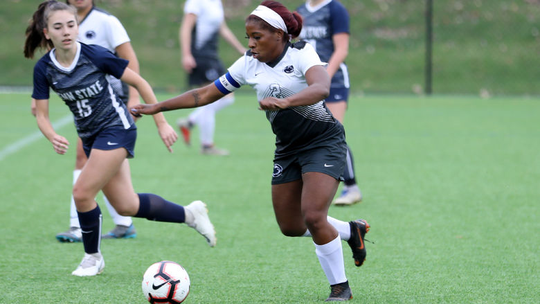 Brianna Banks dribbles past a defender