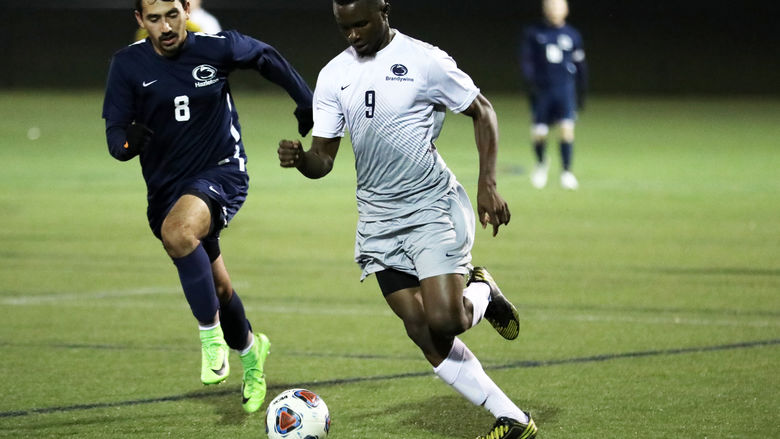 Mohamed Camara dribbles past a defender