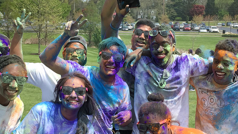 Students tossed colored powder on each other