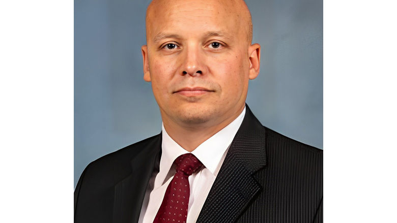 Earl in suit and red tie