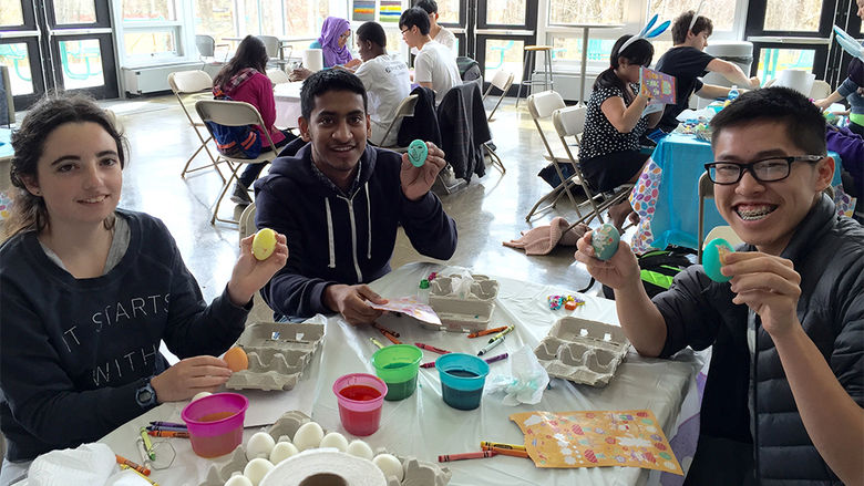 Students decorating eggs