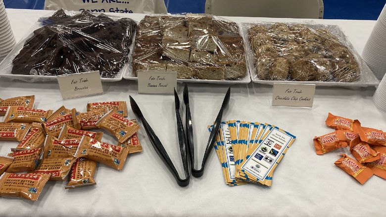 Brownies and cookies are in trays on top of a table.