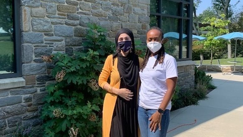 Kimeta Straker and Rabia Rafiqzadah stand outside the Student Union at Penn State Brandywine. 