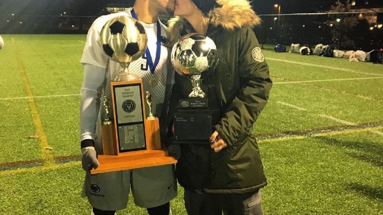esteban and ami kissing while holding trophies