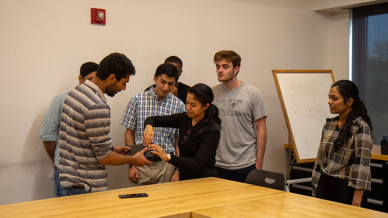 Students working on the 3D printed iLenz prototype