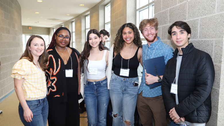students and professor posing for photo