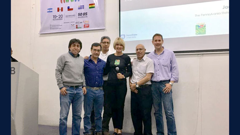 a group of people presenting at a conference