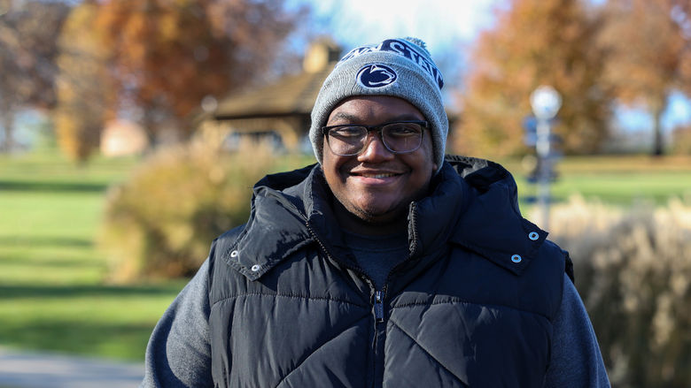Jared McGill smiling wearing a Penn State winter hat