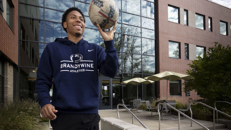 man holding a soccer ball