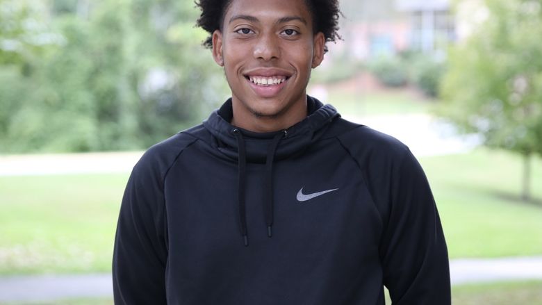 Brandywine senior Khafren Smith standing outside the Main Building.