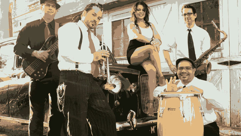 Outdoor group shot of musicians, Los Monstros, with their instruments