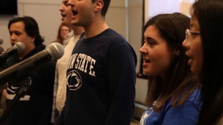 Students singing with microphones