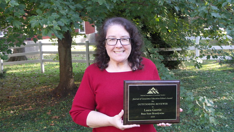 Laura Guertin holding her award. 