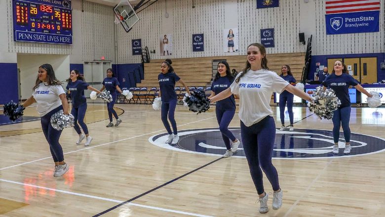 Dancers on the Hype Squad perform on the gym floor during a home basketball game.
