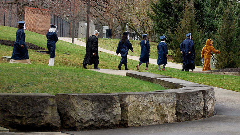 Nittany Lion leading graduates to ceremony