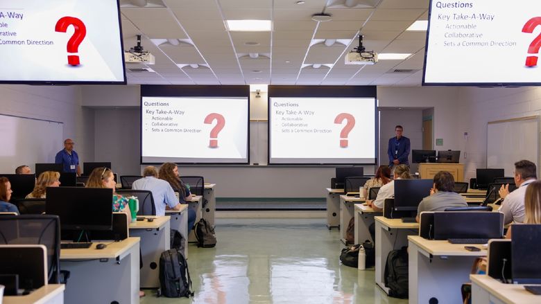 people speaking in classroom