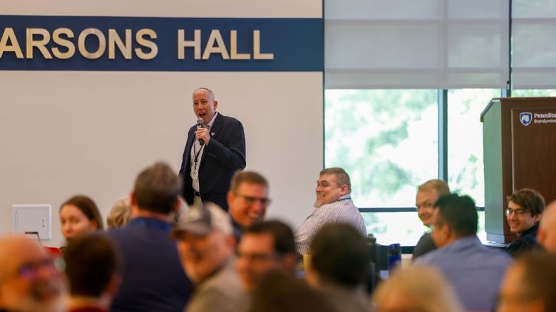 man speaking to audience