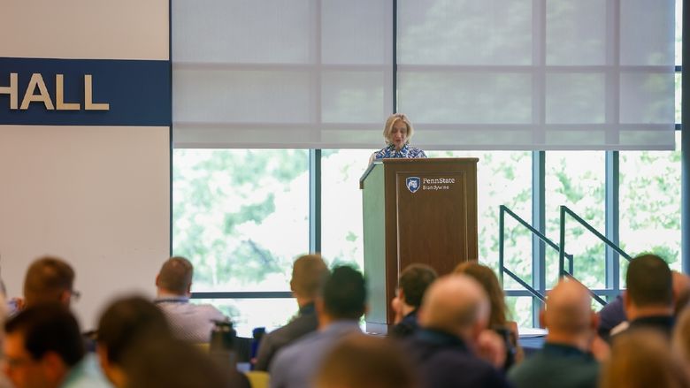 woman speaking at podium