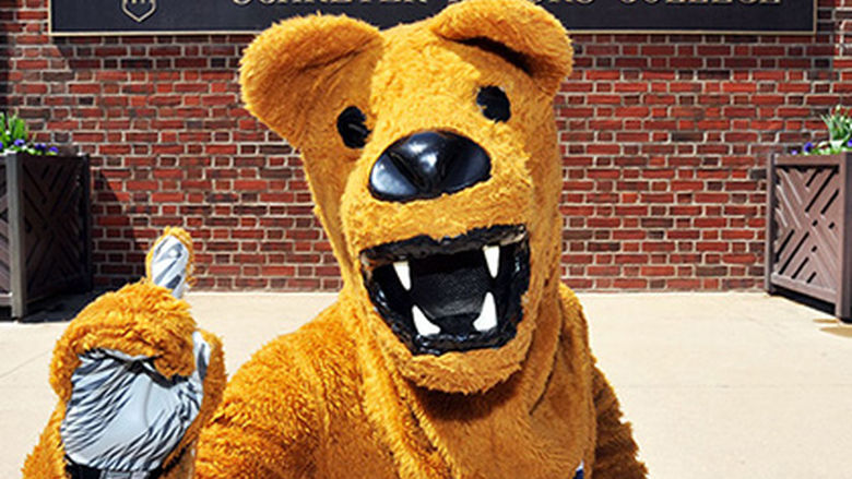 Penn State's Nittany Lion in front of Schreyer Honors College