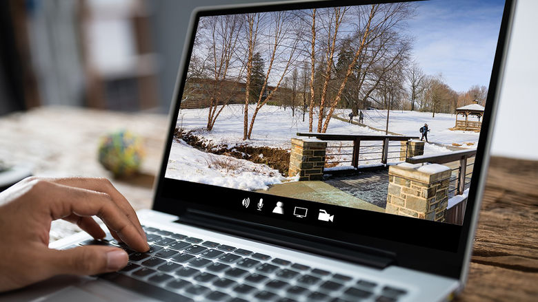 Student taking virtual campus tour on laptop