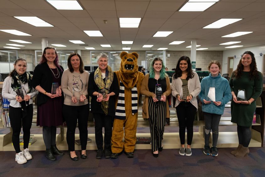The winners of the Nature Narratives writing contest holding their awards.