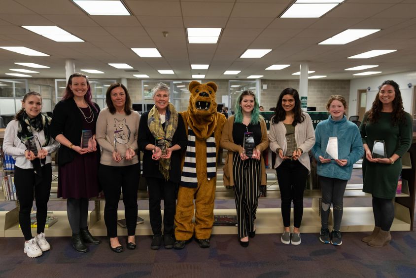 The winners of the Nature Narratives writing contest holding their awards. 