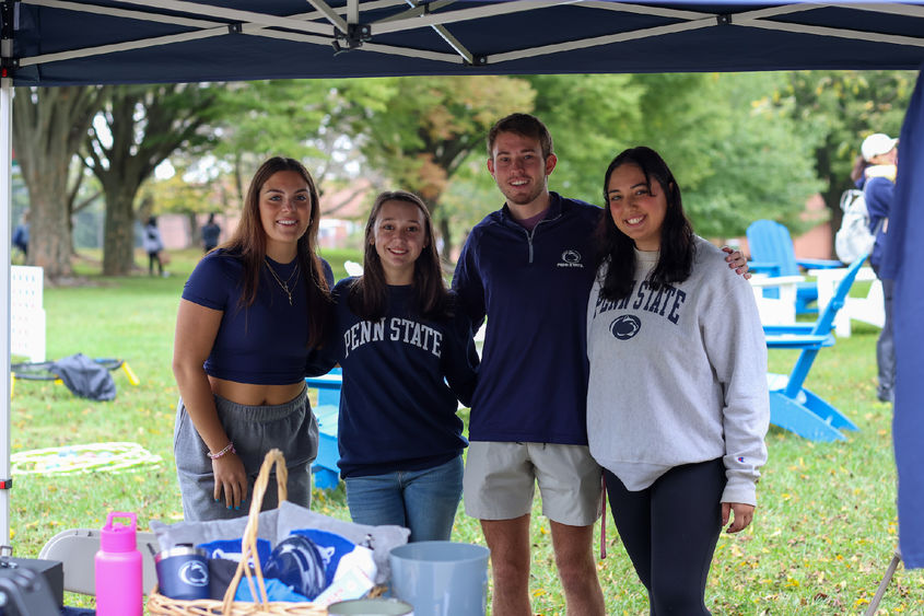 four students smiling