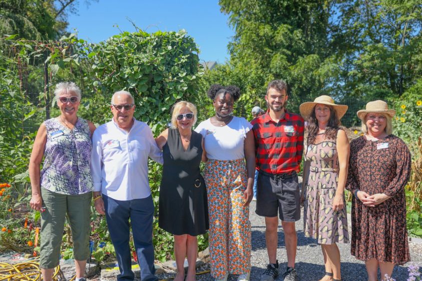 group of people smiling in garden