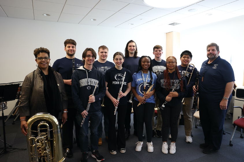 Group of people holding instruments