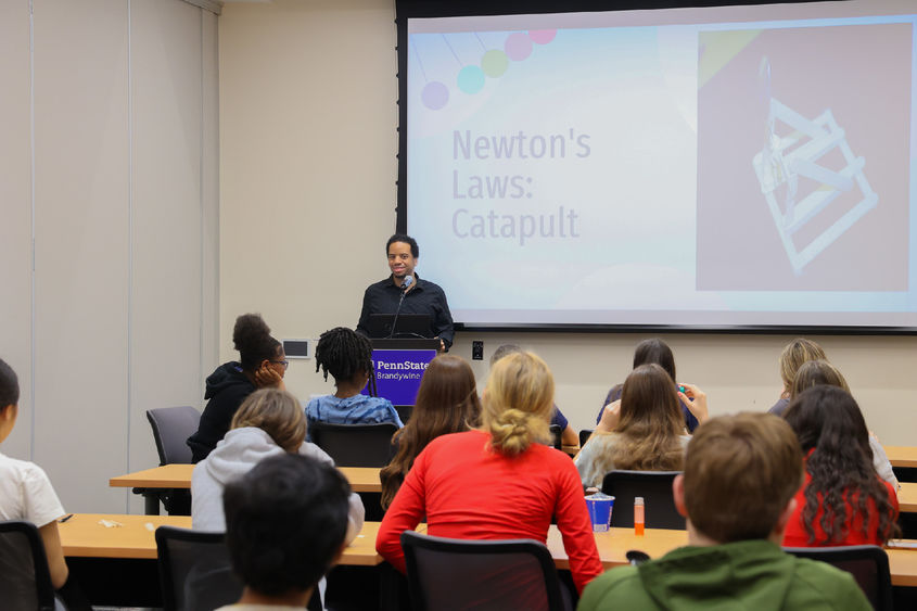 Man giving presentation on Newton's Law