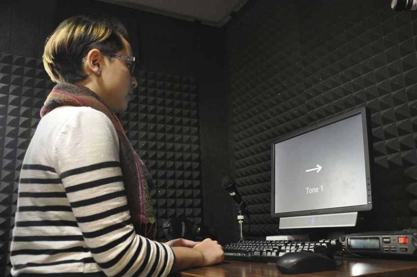 student in soundproof booth