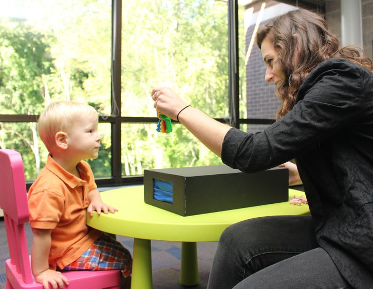 Student showing a child keys