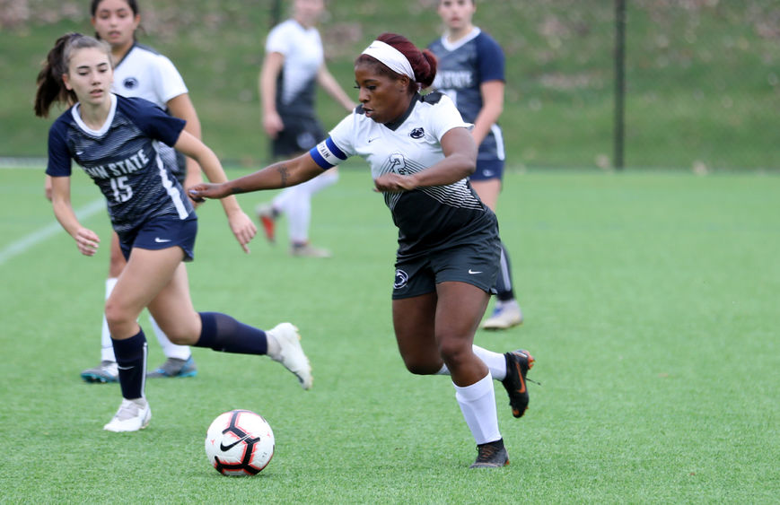 Brianna Banks dribbles past a defender