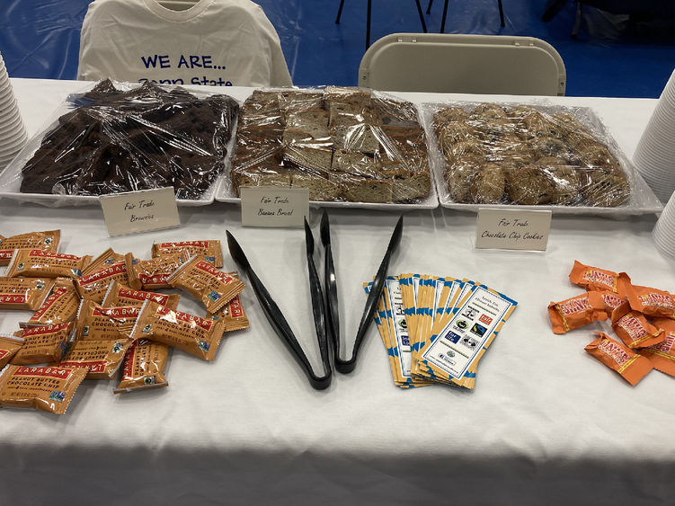 Brownies and cookies are in trays on top of a table.