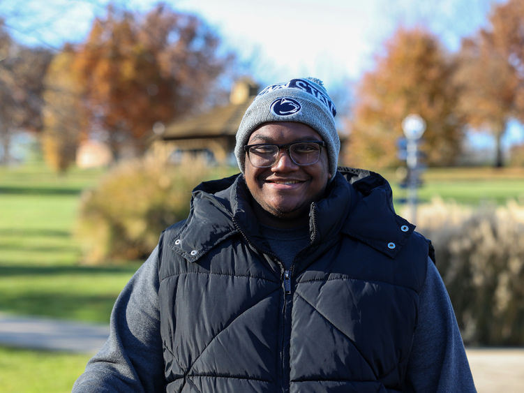 Jared McGill smiling wearing a Penn State winter hat