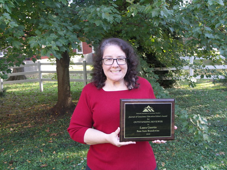 Laura Guertin holding her award. 