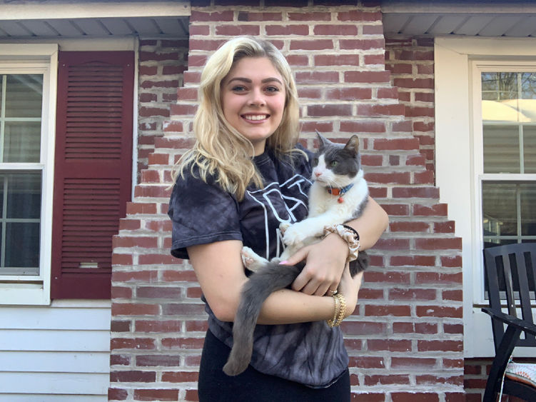 Christianna Kile holding her cat. 