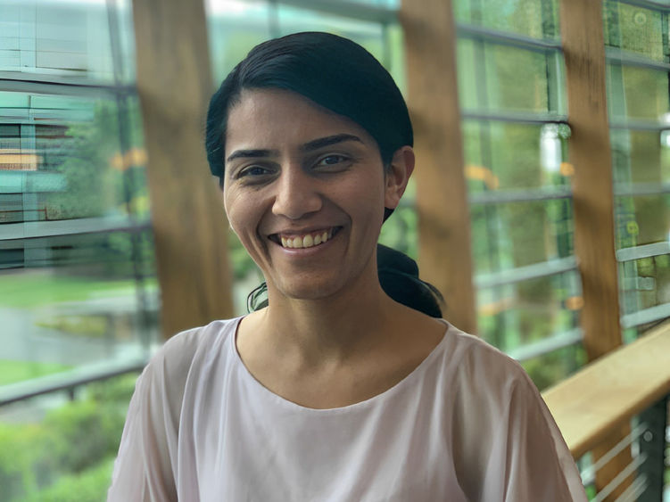 woman smiling with hair in a ponytail 