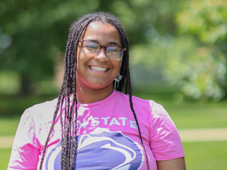 woman wearing glasses and Penn state shirt