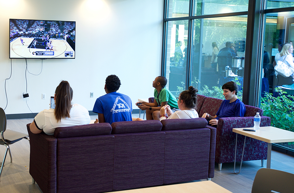 students watching TV in the lounge